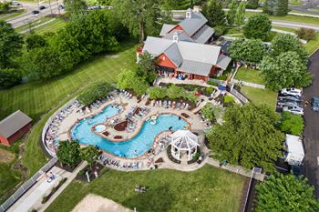 An aerial view of a pool with people enjoying the water.
